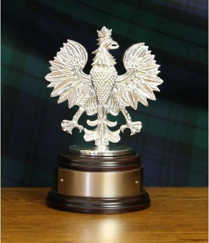A polished pewter sculpture of the 7 Regiment, Royal Logistic Corps (RLC) Polish Eagle. Mounted on a wooden base and includes an optional engraved nickel silver plate.