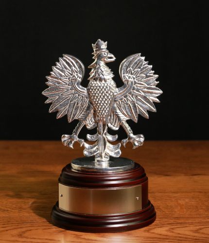 A polished pewter sculpture of the 7 Regiment, Royal Logistic Corps (RLC) Polish Eagle. Mounted on a wooden base and includes an optional engraved nickel silver plate.