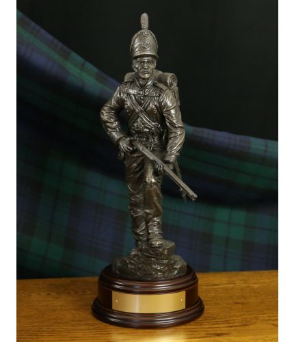 Chosen Man, Rifleman of the 95th, circa 1812. This is a 12" scale sculpture with a choice of finishes, a wooden bases and a fully engraved nameplate on the front of the base. 