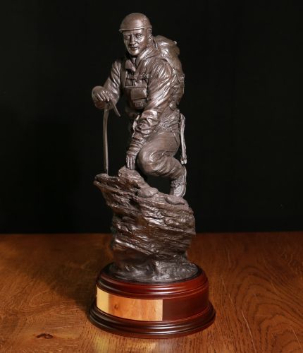 12" Scale Alpine Mountaineering sculpture. Fully equipped for a tough ascent he is climbing a rock face wearing helmet, harness, crampons and carrying an ice axe.  We offer a choice of wooden bases and an engraved brass plate as standard.