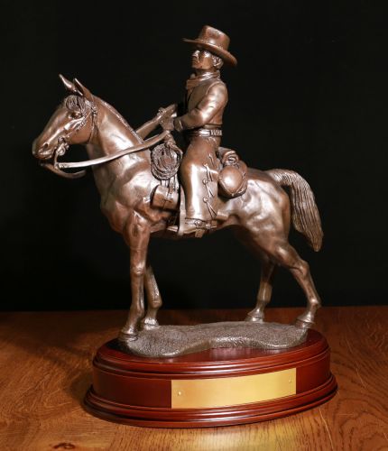 With a total height of 13 inches, this is a display statuette of an American Cowboy, "The Cattle Drive". We offer a choice of wooden base and of course free engraving on some of the base options.