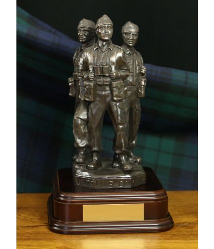 This is the top section of the Achnacarry Commando Memorial at Spean Bridge. The three Commandos are sculpted  8" tall.  We also offer a standard wooden base or you can select the mahogany presentation base. An engraved brass plate is included.