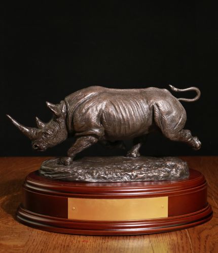 This is our sculpture of a male African Black Rhinoceros, charging. It's made for 1 Armd Division as well. We offer a choice of bases and free engraving