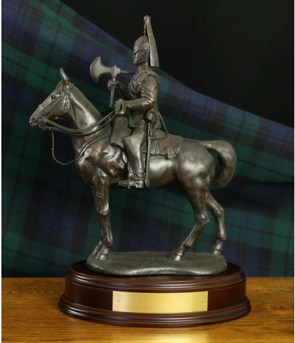 The overall height of this sculpture is 14" and it's of a Blues and Royals British Army Cavalry Regiment Farrier.  We mount for finished piece on its own wooden base and can add an engraved plate with the text of your choice. 