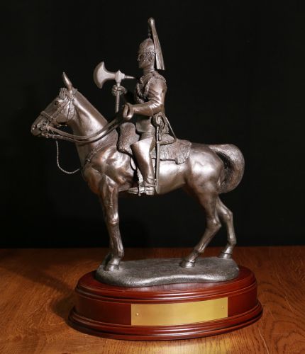 The overall height of this sculpture is 14" and it's of a Blues and Royals British Army Cavalry Regiment Farrier.  We mount for finished piece on its own wooden base and can add an engraved plate with the text of your choice. 