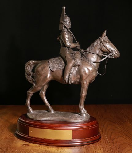 This is a 14" tall sculpture of a Blues and Royals British Army Cavalry Regiment Trooper.  We mount for finished piece on its own wooden base and can add an engraved plate with the text of your choice. 