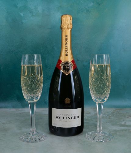 A standard 75cl bottle of Bollinger Special Cuvée Champagne with two Fully Cut Crystal Flutes in a lovely black Presentation Gift box. No Engraving option