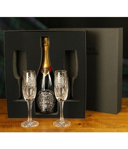 A bottle of Bollinger Special Cuvée Champagne and two engraved flutes all fully engraved. Truly magnificent gifts for your friends, family and colleagues, this beautiful black gift boxed Champagne set is a great gift for a wedding or a birthday.