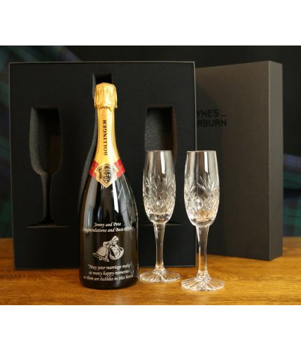 This engraved Bollinger set consists of an engraved (your design) 75cl Bottle of Champagne and two fully cut crystal champagne flutes. The set is beautifully presented in a lovely black, cut out foam presentation box. An Ideal gift for any occasion.