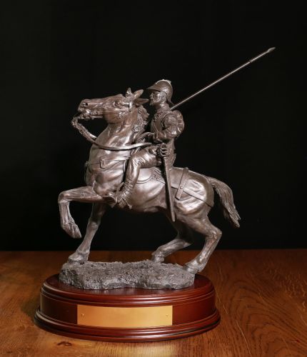 This is our Border Reiver, the beautiful Galashiels War Memorial. The sculpture is made in the 8 inch scale which makes the overall height 14 inches. We include this wooden base as standard and offer an engraving plate free of charge.