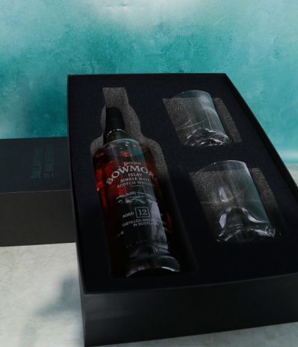 An engraved bottle of 12 Year old Bowmore Single Malt Scotch Whisky and two plain style 10oz crystal whisky tumblers. We work with you regarding the engraving and will provide you with artwork for approval.