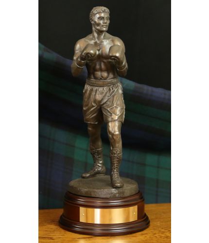 12" Scale cold cast bronze fine art statue, or award of a modern boxer in a classic pose. It's the perfect presentation at any event or occasion involving boxing. As part of the standard service we can provide a fully engraved brass plate on the base.