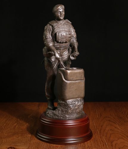 This sculpture depicts a modern day female British Army Chef serving hot food in the field. The sculpture's scale is 12" and therefore the detail we've been able to set out on the piece is excellent. Engraving plate included
