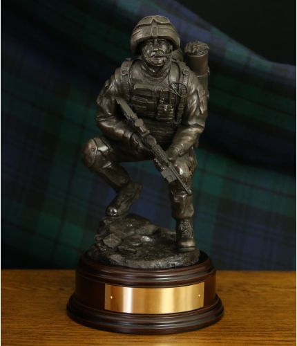 British Army Frontline Medic. This Regimental Statuette of a British Army Medic makes an Ideal mess presentation retirement gift. Ideal for a serving member or veteran of the Royal Army Medical Corps. Wooden base and brass engraved plate included