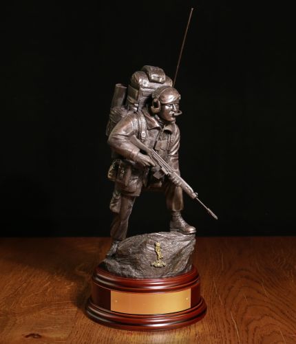 This is a sculpture of a Royal Signals Signaller of the British Army in full operational combat dress. He's in an 'alert' position and carries the SLR rifle.  We offer a choice of wooden bases and personalized engraved