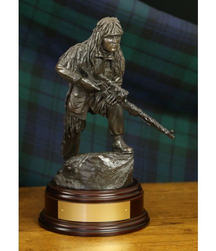 11" scale cold cast bronze resin sculpture of a British Army Sniper with  L96 rifle. We include a choice of wooden base as standard, and you can also add a badge and engraving plate free of charge. 