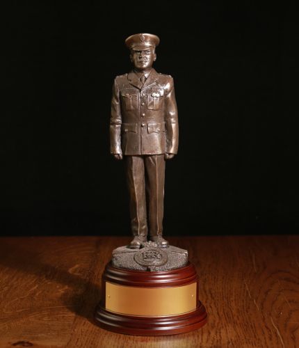 Bronze cold cast resin statuette of a modern officer of the British Prison Service in parade dress. This one of our 8 inch scale statuettes and we include the wooden base and brass plate as standard.