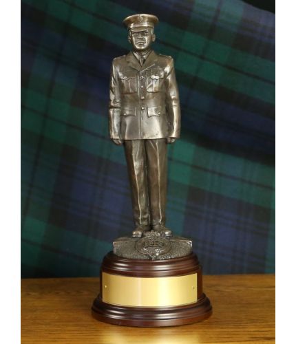 Bronze cold cast resin statuette of a modern officer of the British Prison Service in parade dress. This one of our 8 inch scale statuettes and we include the wooden base and brass plate as standard.