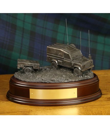 A scale model on a 3/4 Ton FFR Landrover and Trailer in cold cast Bronze Resin. We include this wooden base as standard and can add a capbadge to the base if required. We also offer a free brass plate engraving serice.