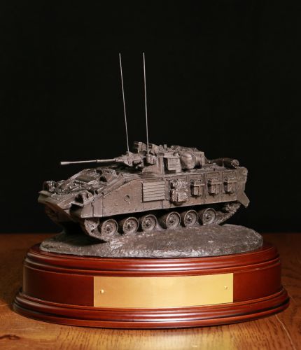 British Army Warrior Infantry Armoured Fighting Vehicle, Desertised, Bronze. The sculpture is mounted on a wooden base which is designed to take a cap badge and engraved plate. It makes an ideal military farewell gift or commemorative piece. 