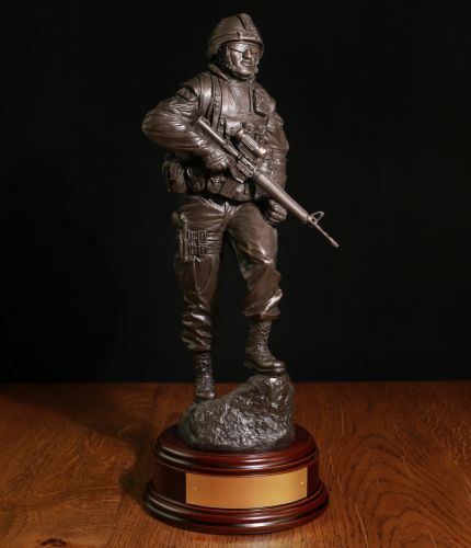 This 12" scale sculpture depicts a modern Canadian Army Infantryman on foot patrol, perhaps in Afghanistan. We include this wooden base as standard and offer an engraving plate free of charge.