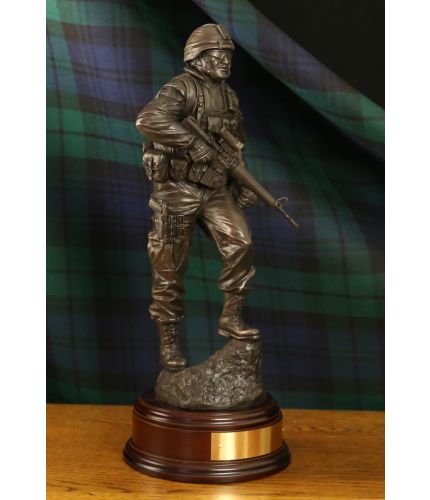 This 12" scale sculpture depicts a modern Canadian Army Infantryman on foot patrol, perhaps in Afghanistan. We include this wooden base as standard and offer an engraving plate free of charge.