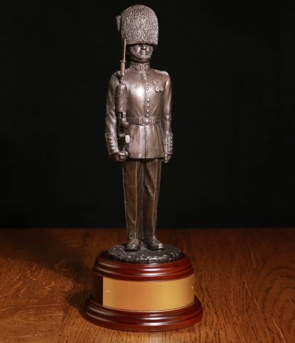 Bronze resin 8" scale statuette of a Guardsman of The Coldstream Guards dressed in parade dress with bearskin and SA80. We include a choice of wooden bases, and an engraved brass plate as standard.