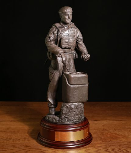 This sculpture depicts a modern day male British Army Chef serving hot food in the field. The sculpture's scale is 12" and therefore the detail we've been able to set out on the piece is excellent. Engraving plate included