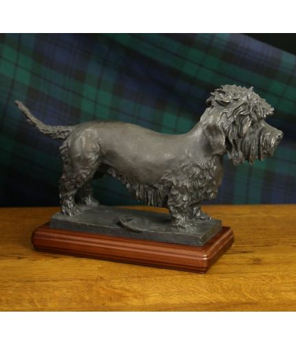 This is a faithful and fully authorised replica of Alexander Stoddart's statue of Old Ginger, a bronze statue commemorating “Old Ginger”, the founding father of the Dandie Dinmont Terrier.  The statue stands in the grounds of The Haining, Selkirk.  This i