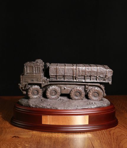 This is a Cold Cast Bronze model of a British Army DROPS Resupply truck. We include this wooden base as standard, and you can also add a badge and engraving plate free of charge.