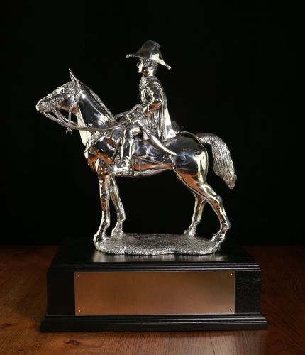 This is our Duke of Wellington statuette. He's mounted on Copenhagen during the Battle of Waterloo and it is made in the 8 inch scale, (overall height 14 inches). We include the standard wooden base and an engraved brass plate.