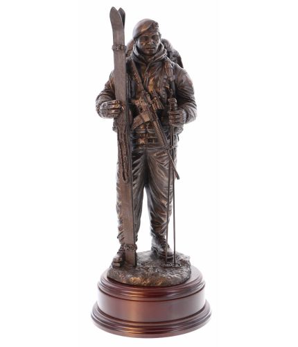 This is a sculpture of a Dutch Marine deployed for Winter Warfare in the Arctic. It is sculpted in a 12" scale. We supply the wooden base and an engraved brass plate
