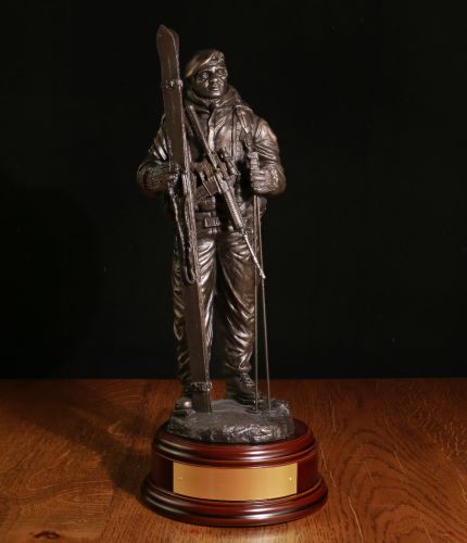 This is a sculpture of a Dutch Marine deployed for Winter Warfare in the Arctic. It is sculpted in a 12" scale. We supply the wooden base and an engraved brass plate