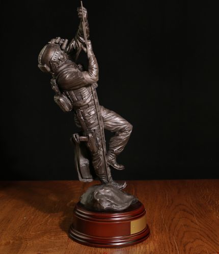 This is a sculpture of a Dutch NL MARSOF Frogman Climbing a scaling ladder at sea. It is sculpted in a 12" scale. We offer a choice of finish and wooden base. An engraved brass plate can be provided free of charge