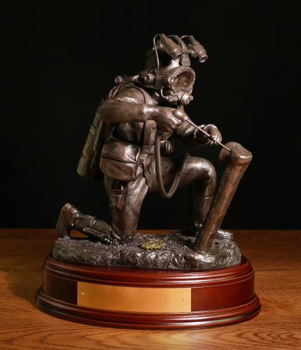 Cold Cast Bronze presentation sculpture depicting an Industrial or Military Diver on Seabed. We offer it with the wooden base of your choice and an optional brass engraved plate.