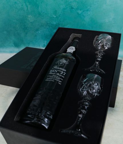 An engraved 75cl Bottle of Fonseca Bin 27 Port and fully cut crystal port glasses in a black foam cut out gift box. The Bottle can be engraved, and we sort this out with you after ordering. The Glasses, with their fully cut bowls cannot be engraved.