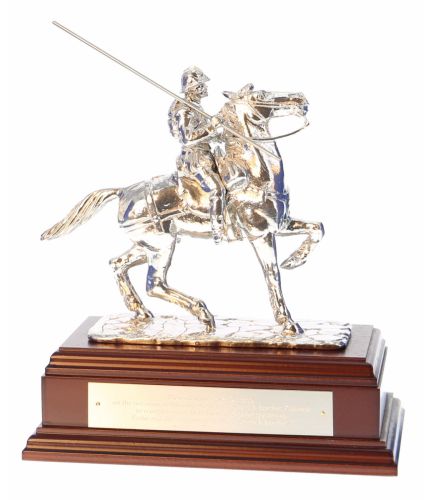 This is the polished pewter sculpture of the Galashiels War Memorial. It stands 10" tall from the horse's hoof to the tip of the lance. we attach it to its wooden base and we can add a free engraved nickel silver plate if requested