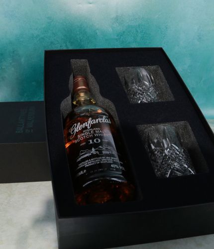 This is a whisky presentation set consisting of an engraved bottle of 10 Year old Glenfarclas Single Malt Scotch Whisky and two fully cut 10oz crystal whisky tumblers. We work with you on what you'd like us to engrave on the bottle.
