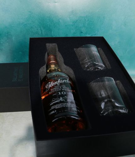 A fully engraved bottle of 10 Year old Glenfarclas Single Malt Scotch Whisky and two engraved 10oz crystal whisky tumblers. The set is presented in this black box with foam cutouts. Engraving sorted afterwards.