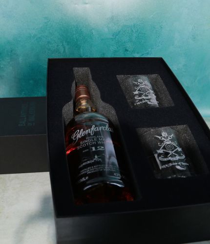 A fully engraved bottle of 12 Year old Glenfarclas Single Malt Scotch Whisky and two engraved 10oz crystal whisky tumblers. The set is presented in this black box with foam cutouts. Engraving sorted afterwards.