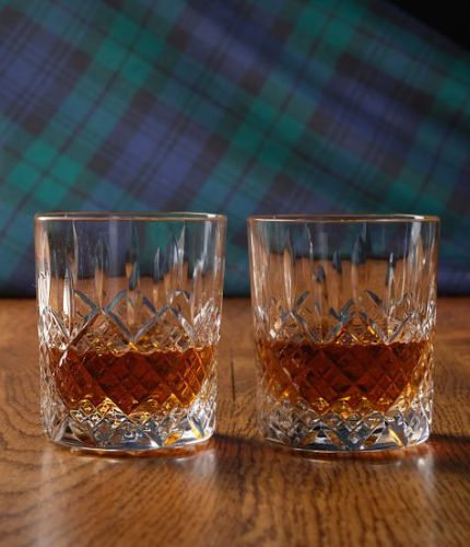 A fully cut pair of 24% Lead Crystal Whisky Tumblers. The set is completed inside a dark blue satin lined presentation box.