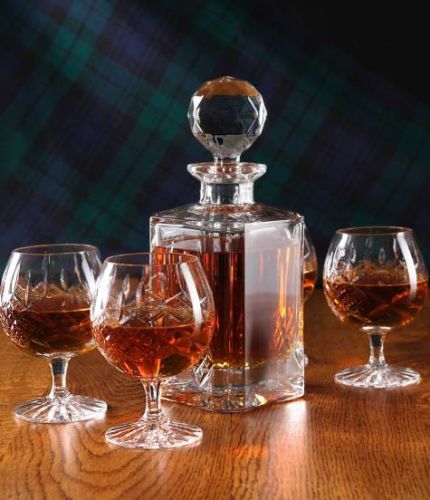 This is a 5 piece brandy, panel cut, hosting set consisting of a decanter and four brandy goblets. We offer hand engraving on the front panels. The set is completed with dark blue satin-lined presentation boxes for display and storage