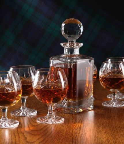 A Panel cut set of brandy hosting crystal consisting of a decanter and six goblets. We offer free engraving in the front panels of each item and the set is completed inside two dark blue satin lined presentation boxes.