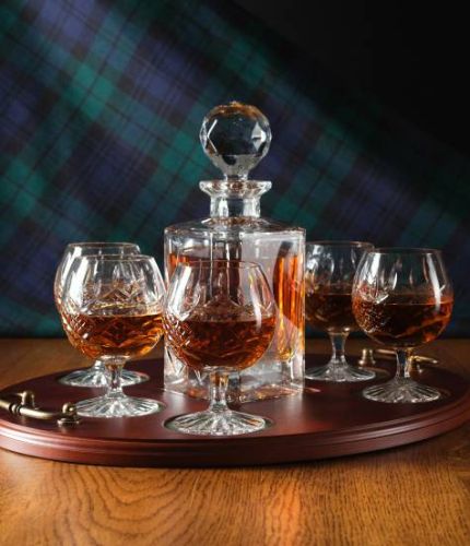 A 24% lead crystal panel cut square decanter and six panel cut brandy goblets on a serving tray. We can offer a personalised engraving on the front of the decanter, goblets and an engraved brass plate on the wooden tray with this set.
