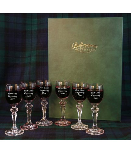 A set of six engraved port glasses in a dark green satin lined presentation box.