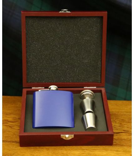 A Navy Blue 6oz stainless steel hip flask with two thimble cups, filler funnel presented in its own lovely wooden box with cut-out foam inner. We include our full design and engraving service on the front of the hip flask.