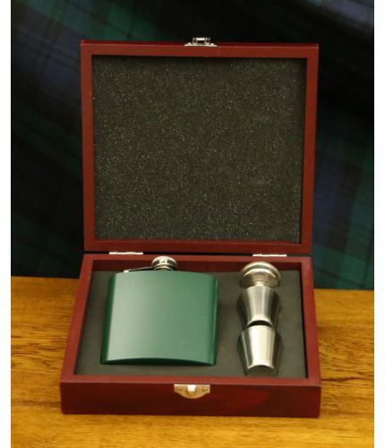 A dark green 6oz stainless steel hipflask with two thimble cups, filler funnel presented in its own lovely wooden box with cut-out foam inner. We include our full design and engraving service on the front of these items.