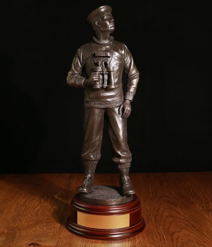 HMS Submariner standing 14" Tall. This sculpture is widely used within the Royal Navy Submarine Service and an end of career, retirement, promotion or long service gift. We offer a choice of wooden base and include an engraved brass plate.