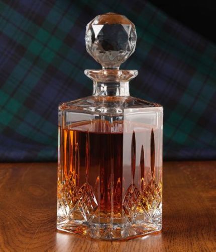 A fully cut 24% Lead Crystal Whisky Decanter. The set is completed inside a dark blue satin lined presentation box.