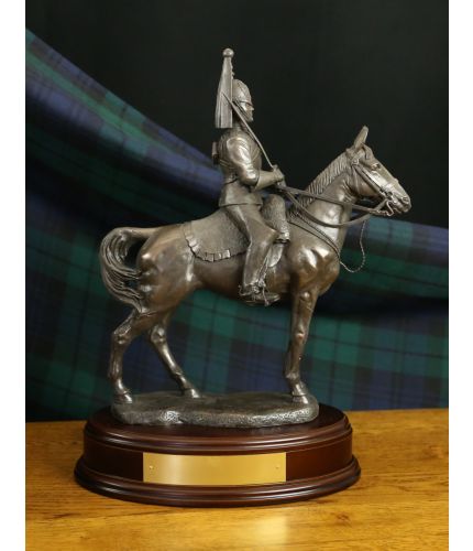 This is a 14" tall sculpture of a Life Guard Cavalry Regiment Trooper.  We mount for finished piece on its own wooden base and can add an engraved plate with the text of your choice.